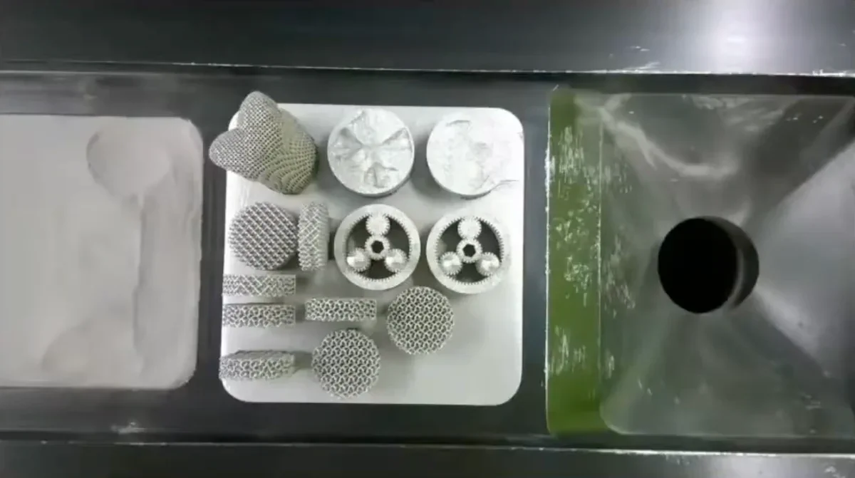 Metal parts produced by powder bed fusion, showcasing intricate lattice structures and circular designs.